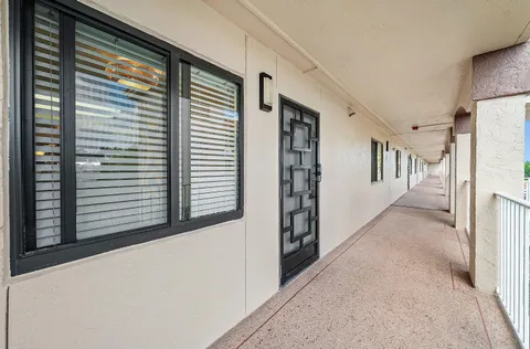 a view of a hallway with windows