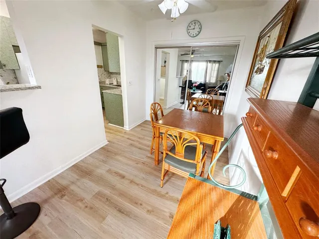 a dining room with furniture and window
