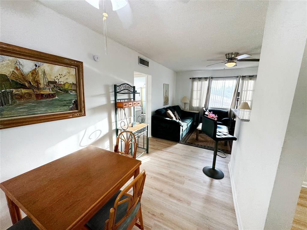 310 South Cypress Road, Unit 729 Pompano Beach, FL 33060 - Photo 15 of 30 a dining room with furniture and window