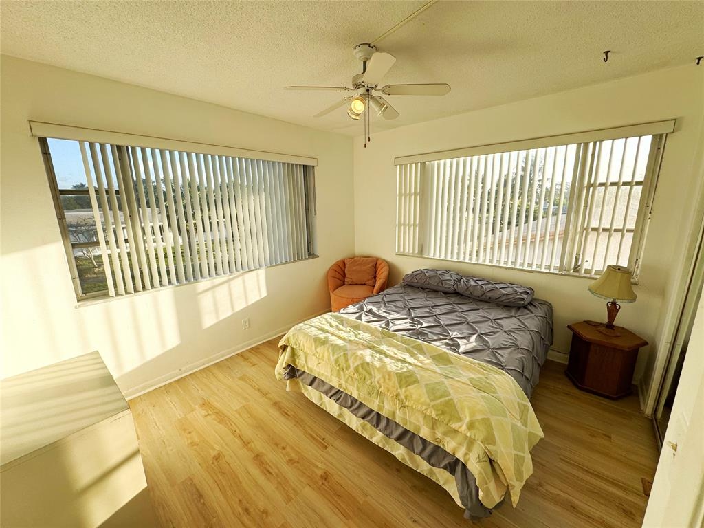 310 South Cypress Road, Unit 729 Pompano Beach, FL 33060 - Photo 20 of 30 a spacious bedroom with a bed and a window