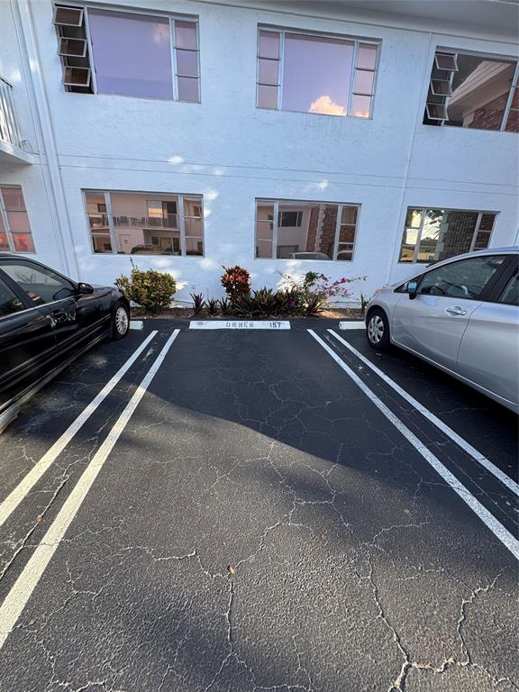 310 South Cypress Road, Unit 729 Pompano Beach, FL 33060 - Photo 28 of 30 a view of a city street with cars