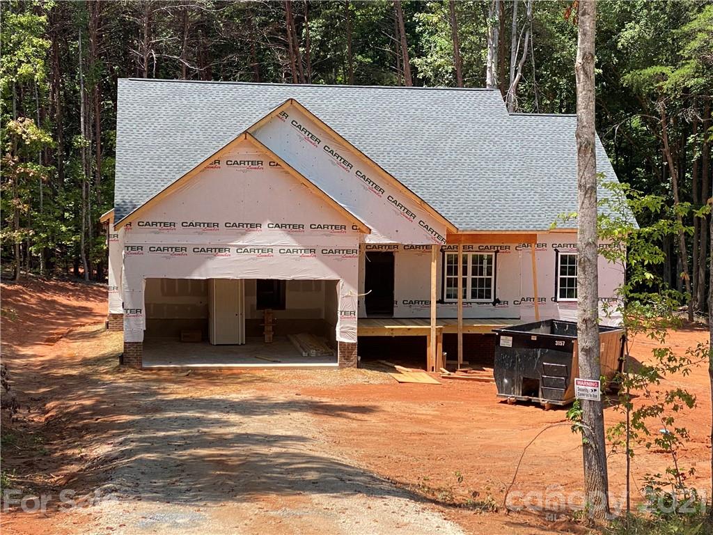 1063 Rhyne Road Clover, SC 29710 - Photo 1 of 9 a view of a house with a swimming pool