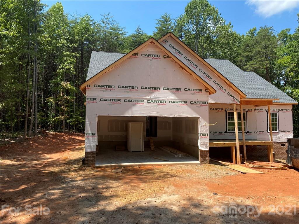 1063 Rhyne Road Clover, SC 29710 - Photo 2 of 9 a view of a house with a garage and yard