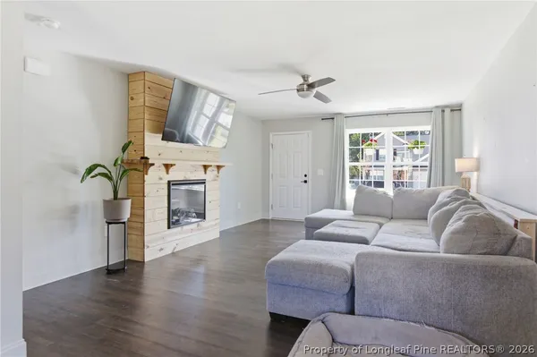 a living room with furniture and a fireplace