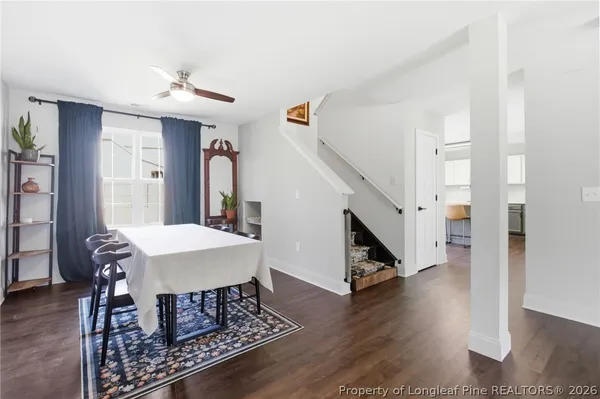 a kitchen with kitchen island granite countertop a sink cabinets and stainless steel appliances