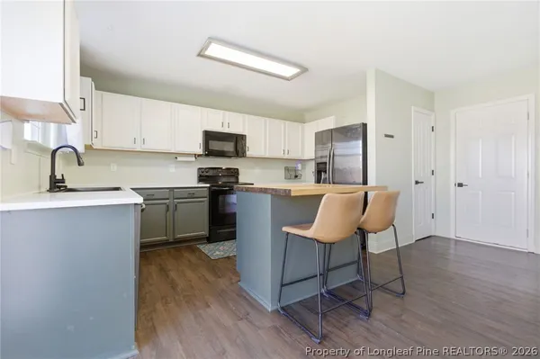 a kitchen with cabinets and stainless steel appliances