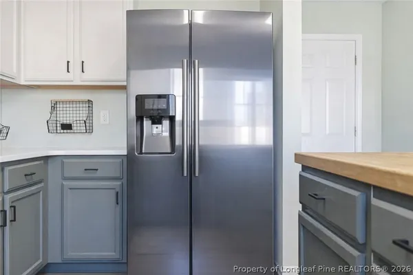 a stove top oven sitting inside of a kitchen