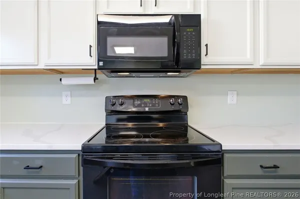 a view of bedroom with furniture and staircase
