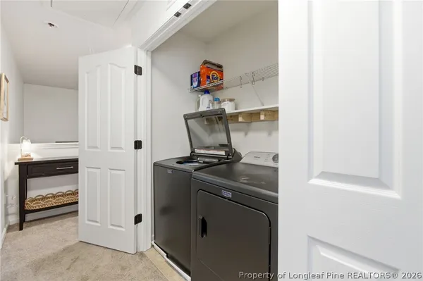 a kitchen with stainless steel appliances granite countertop a refrigerator and a stove