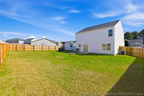 a view of a back yard of the house