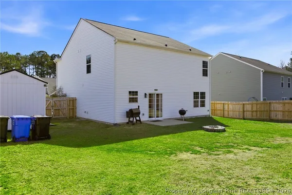 a view of a backyard with a small cabin