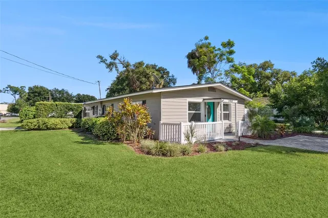 a view of a house with a yard