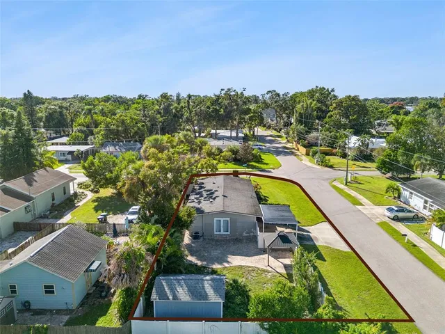 an aerial view of a house with a garden
