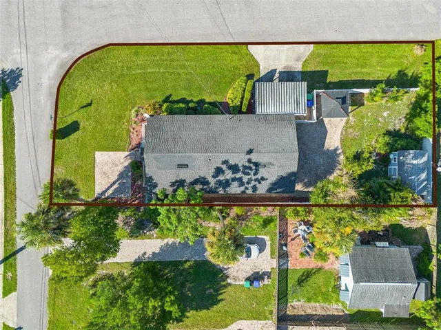 an aerial view of residential houses with outdoor space