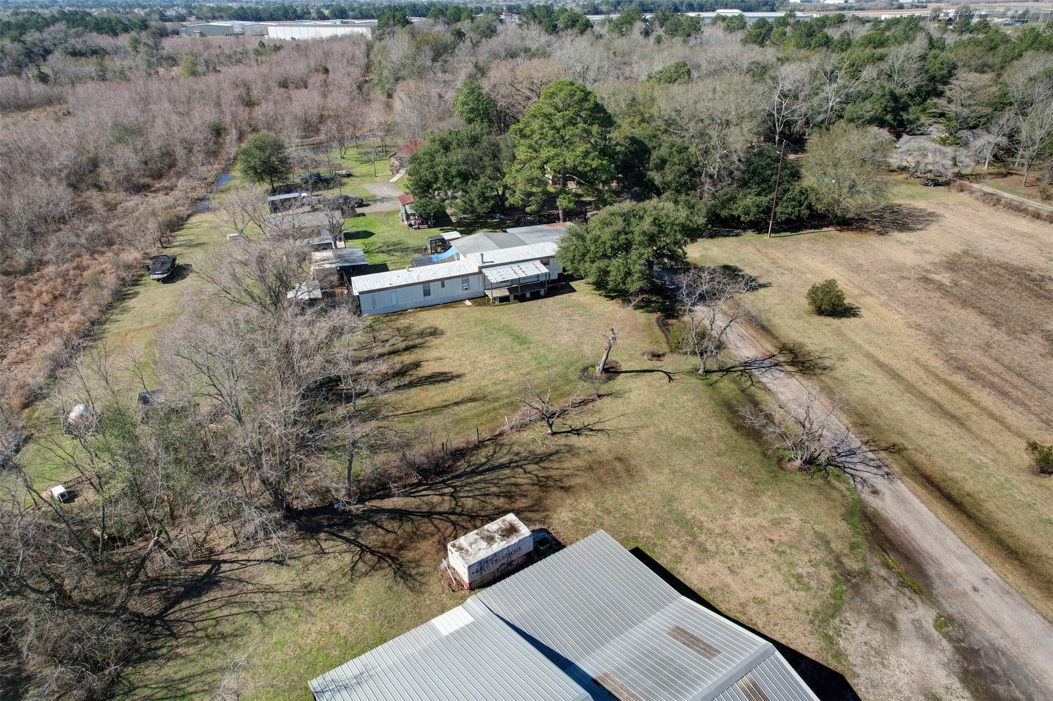 19403 Stuebner Airline Road Spring, TX 77379 - Photo 5 of 6 a view of a dry yard with wooden fence