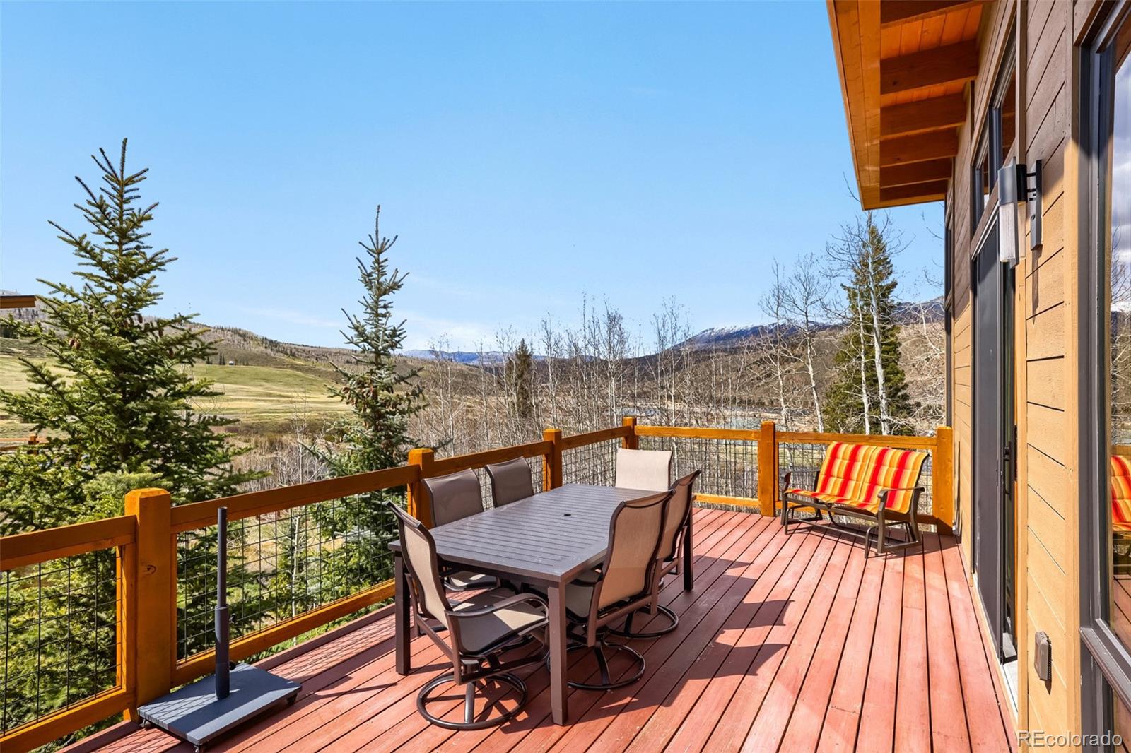 836 Maryland Creek Road Silverthorne, CO 80498 - Photo 25 of 49 a view of a balcony with furniture and wooden floor