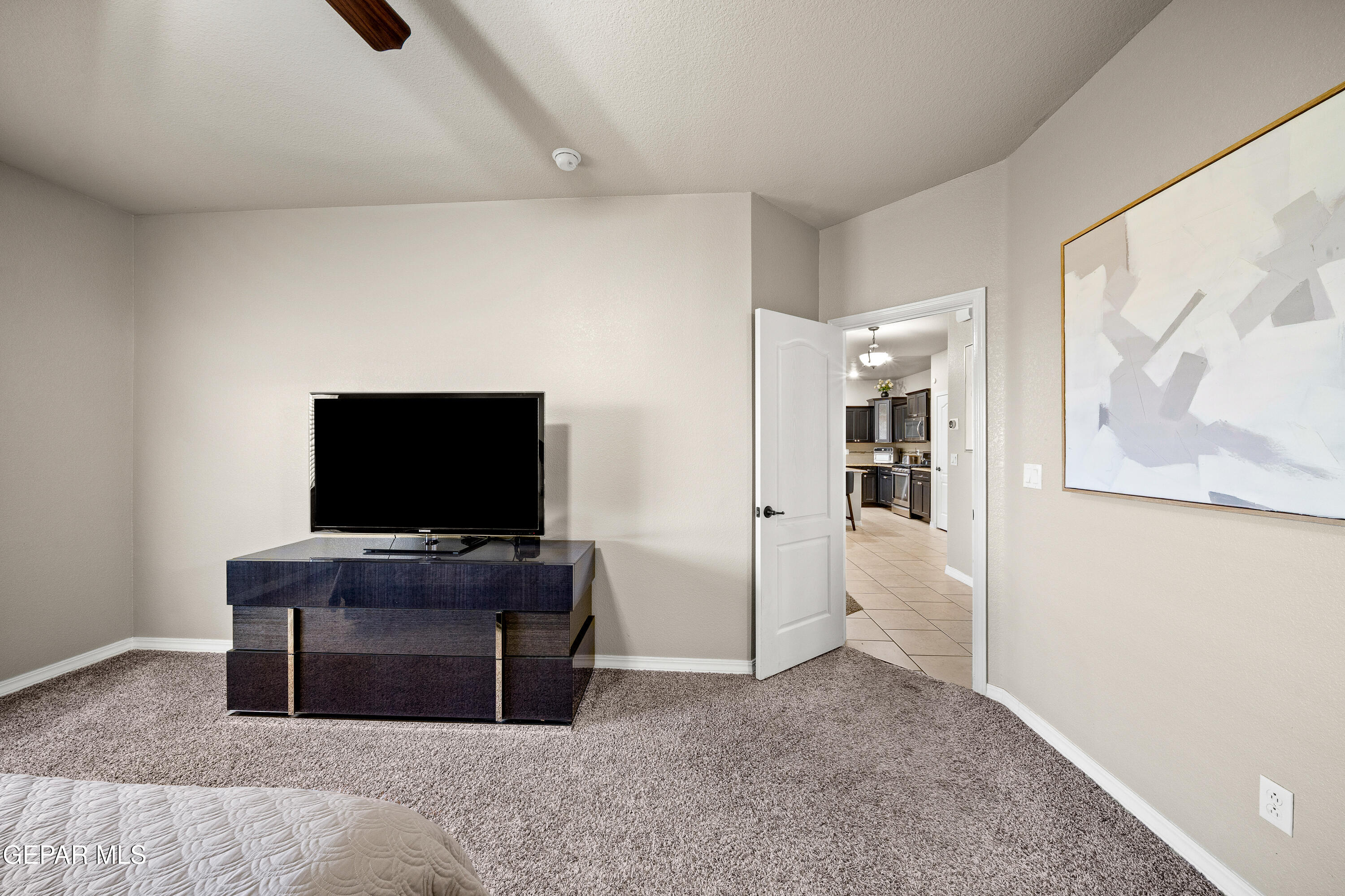 7755 Enchanted Path Drive El Paso, TX 79911 - Photo 12 of 34 a living room with furniture and flat screen tv