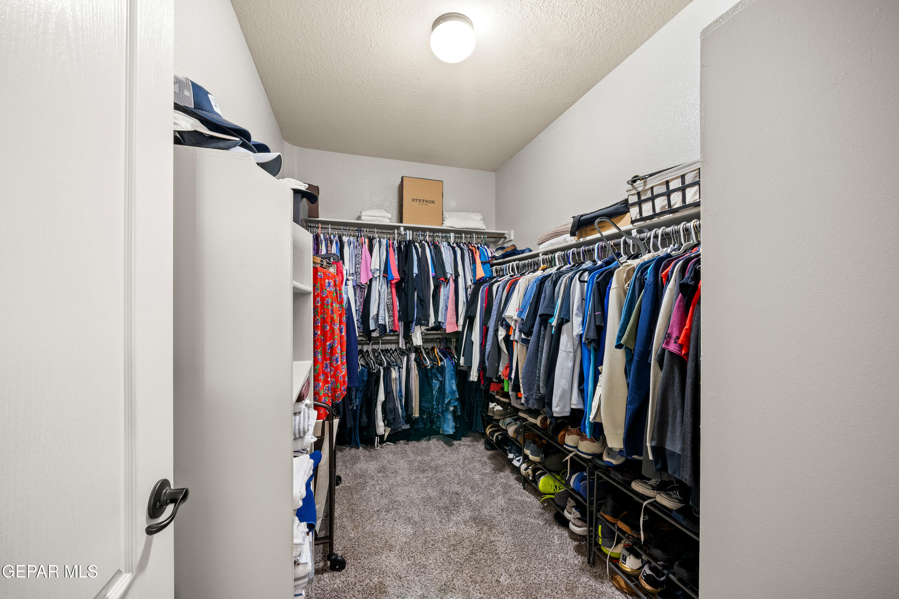 7755 Enchanted Path Drive El Paso, TX 79911 - Photo 16 of 34 a view of walk in closet with clothes