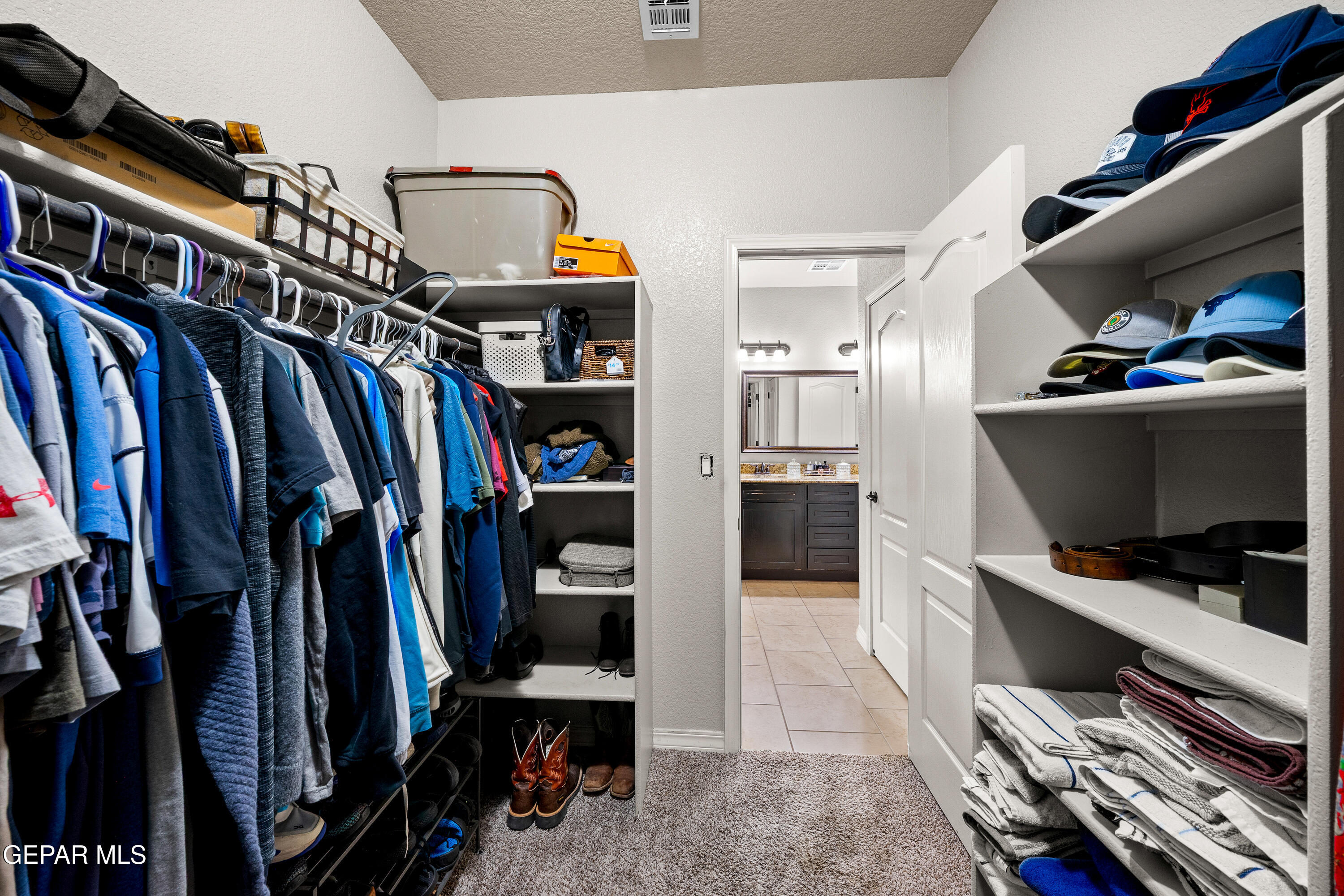 7755 Enchanted Path Drive El Paso, TX 79911 - Photo 17 of 34 a view of walk in closet with clothes and shoes