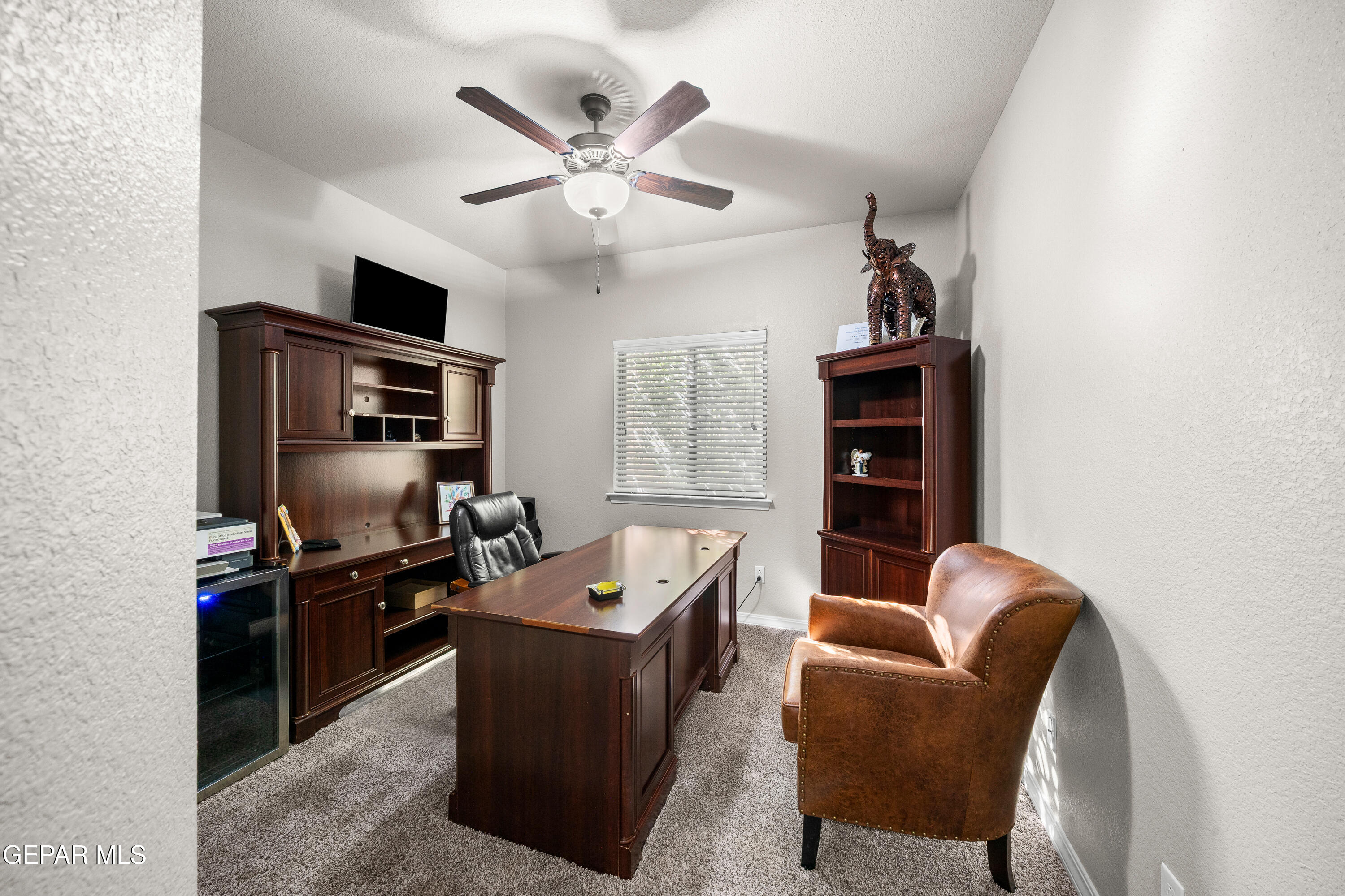 7755 Enchanted Path Drive El Paso, TX 79911 - Photo 25 of 34 a living room with furniture ceiling fan and a window