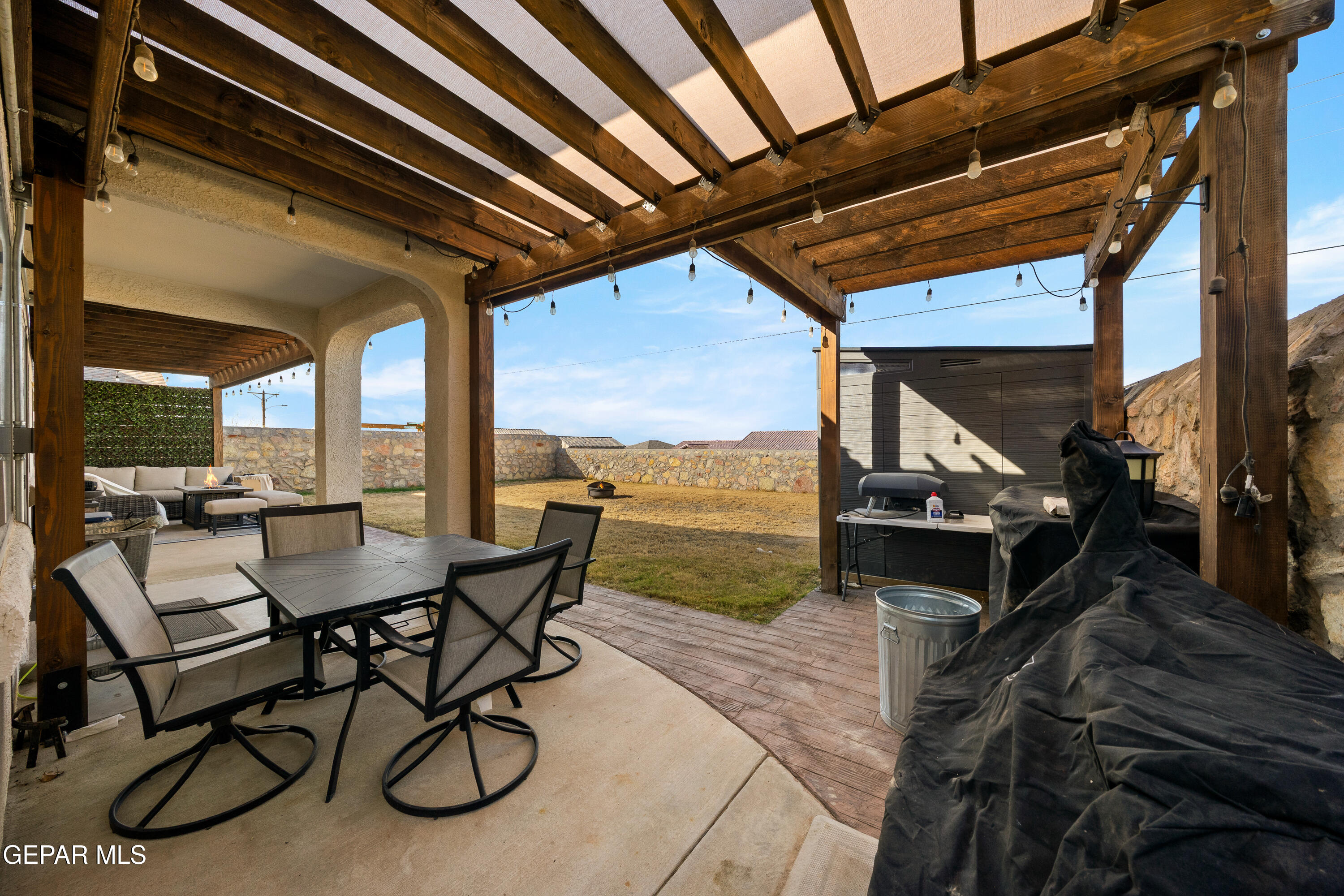 7755 Enchanted Path Drive El Paso, TX 79911 - Photo 28 of 34 a view of a chairs and table in the patio