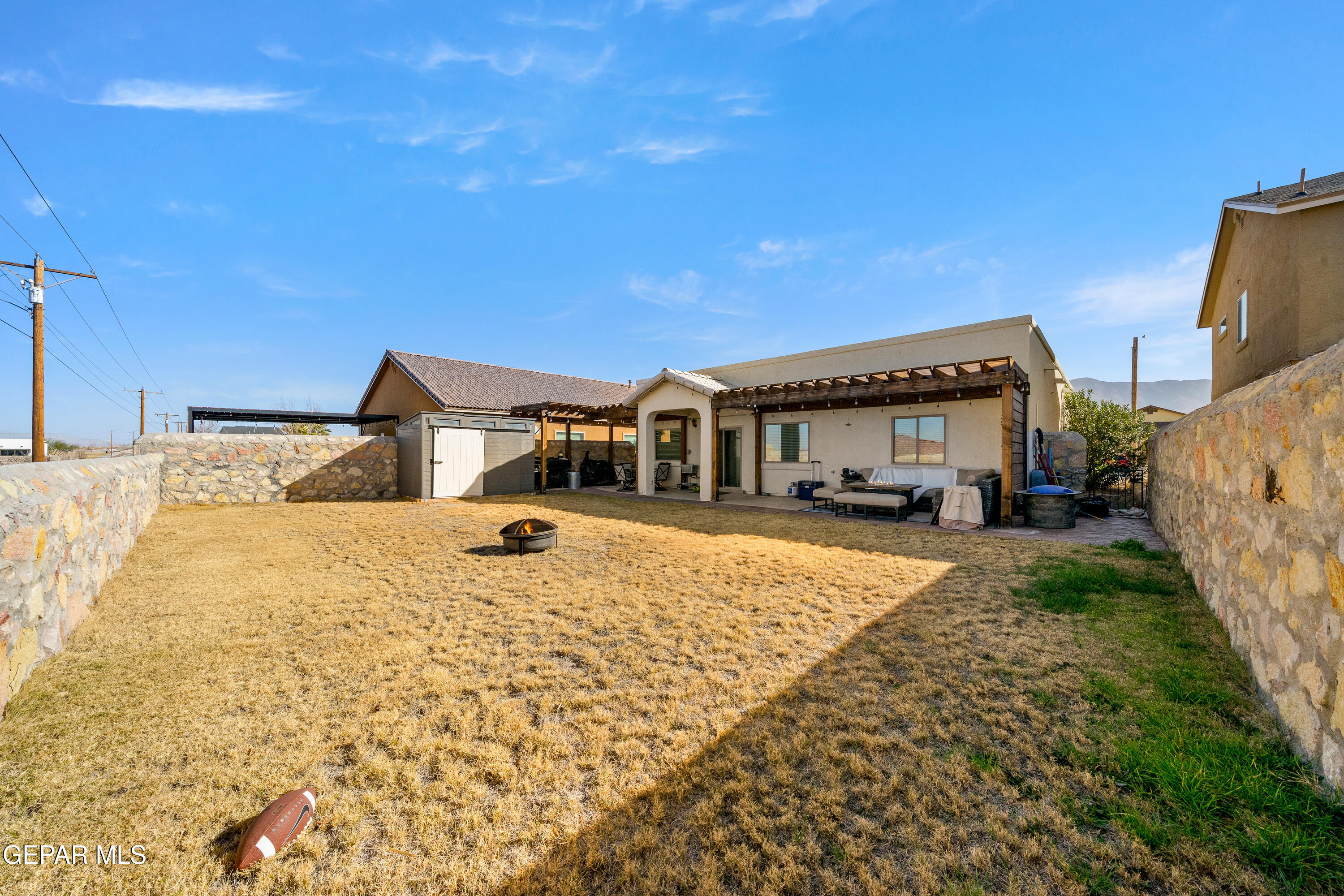 7755 Enchanted Path Drive El Paso, TX 79911 - Photo 31 of 34 a view of a house with backyard and trees