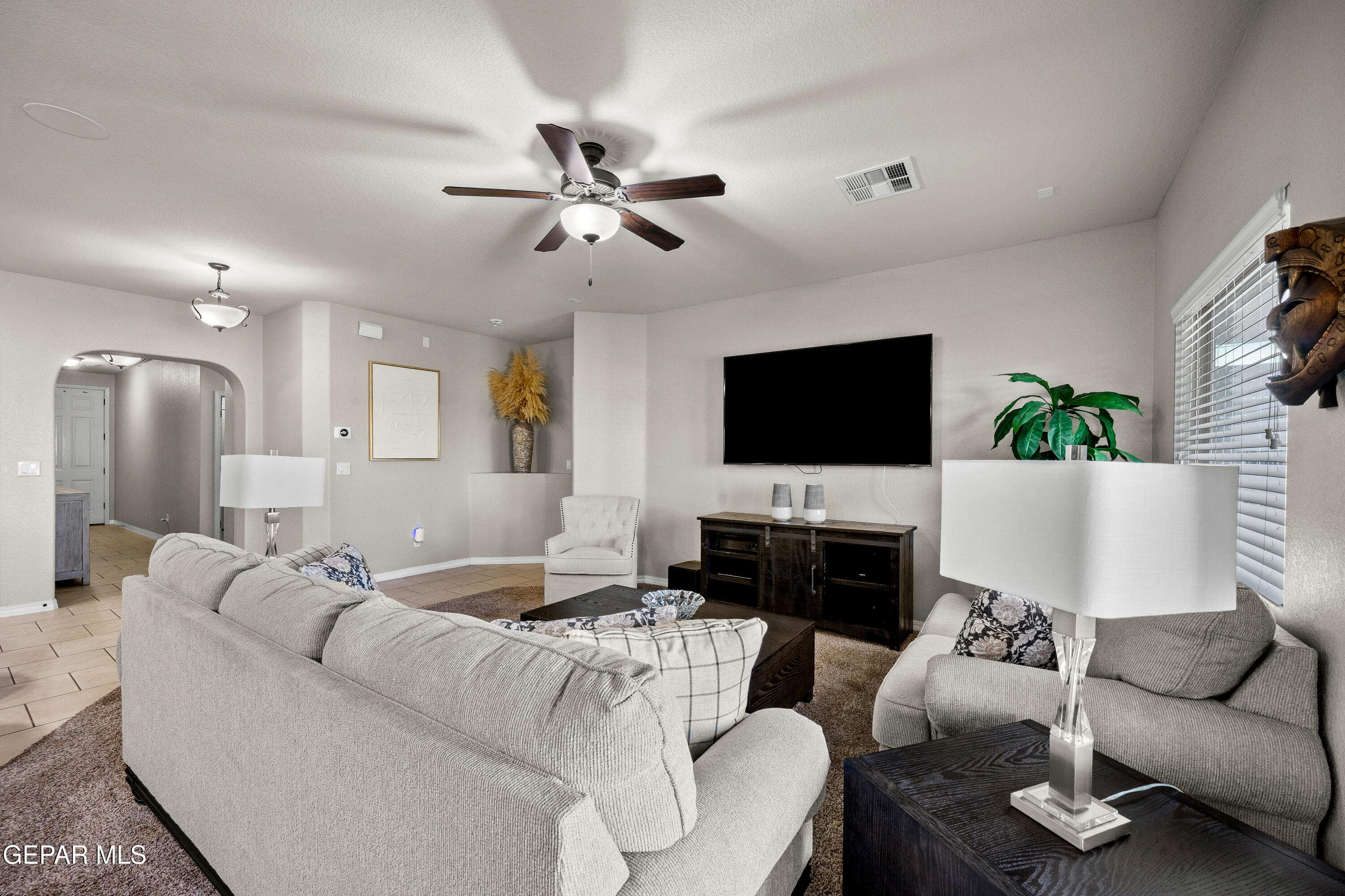 7755 Enchanted Path Drive El Paso, TX 79911 - Photo 4 of 34 a living room with furniture and a flat screen tv