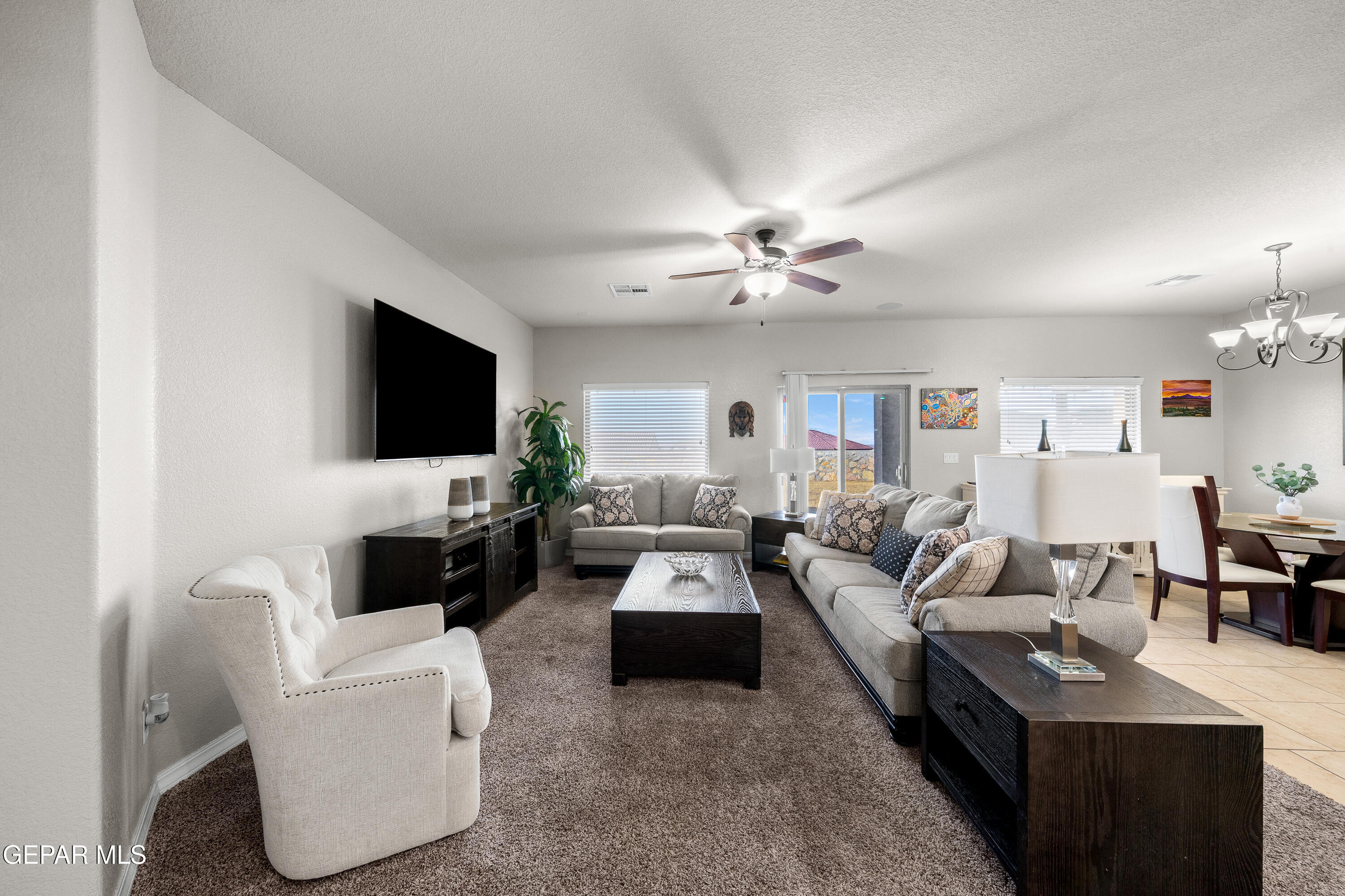 7755 Enchanted Path Drive El Paso, TX 79911 - Photo 5 of 34 a living room with furniture and a flat screen tv