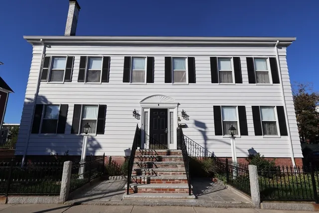 a front view of a house with stairs