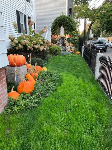 a group of cars parked in front of a house
