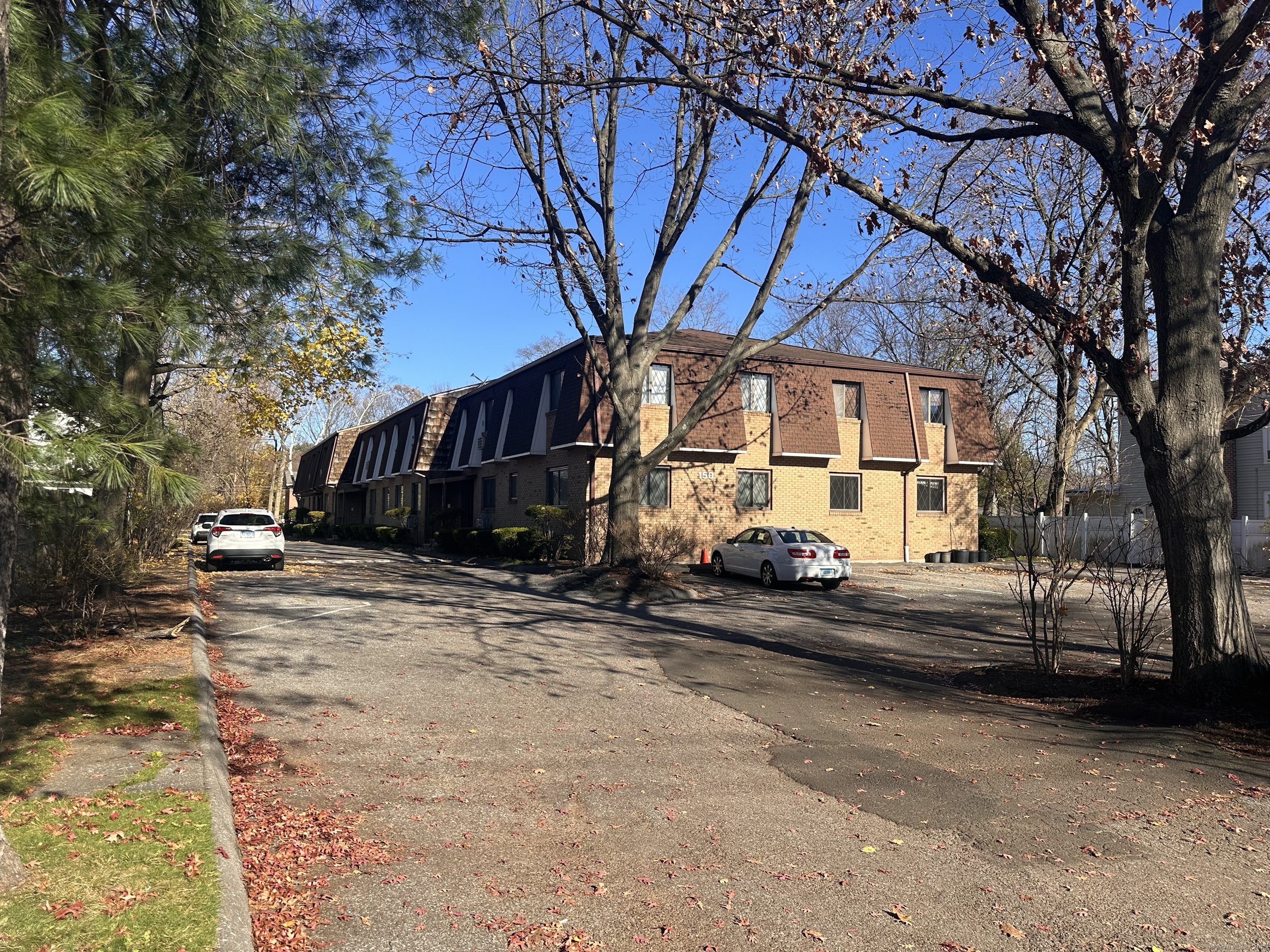 150 Main Street, Unit B6 Norwalk, CT 06851 - Photo 1 of 15 a view of a house with a yard