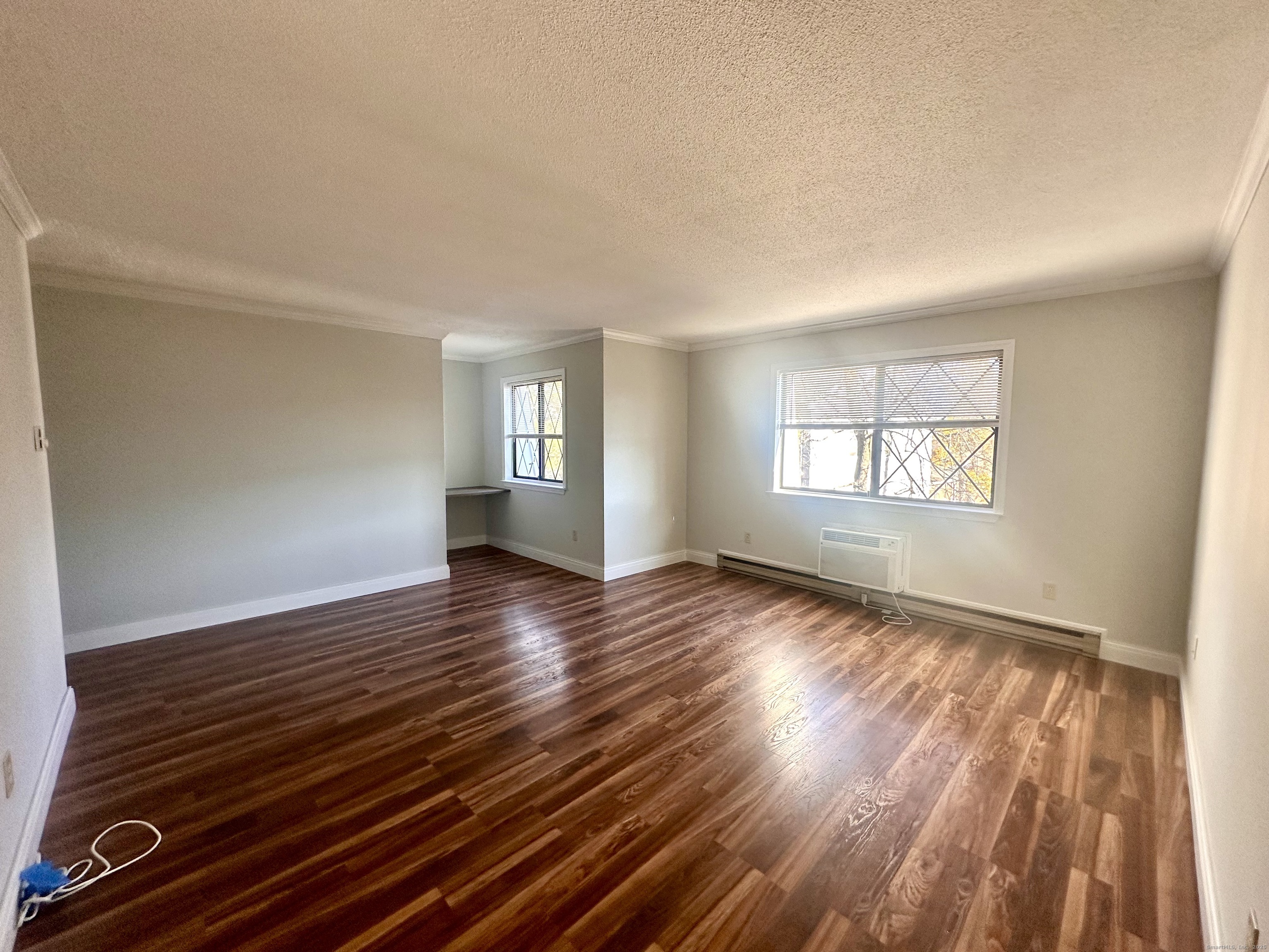 150 Main Street, Unit B6 Norwalk, CT 06851 - Photo 14 of 15 an empty room with wooden floor and windows