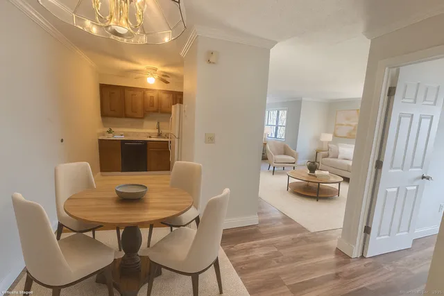 a living room with furniture and a breakfast area