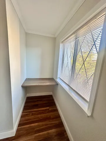 a view of entryway with wooden floor and window