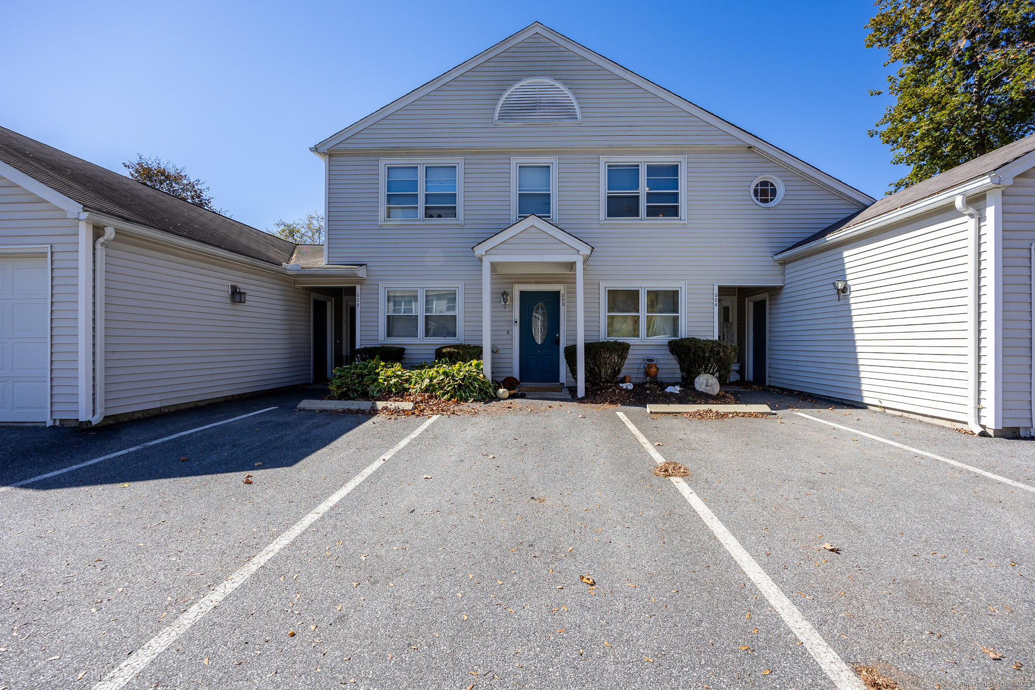 699 South Main Street, Unit 323 Torrington, CT 06790 - Photo 1 of 1 a front view of a house with yard and parking