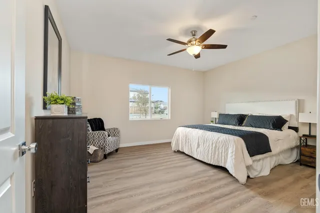 a bedroom with a bed and a dresser