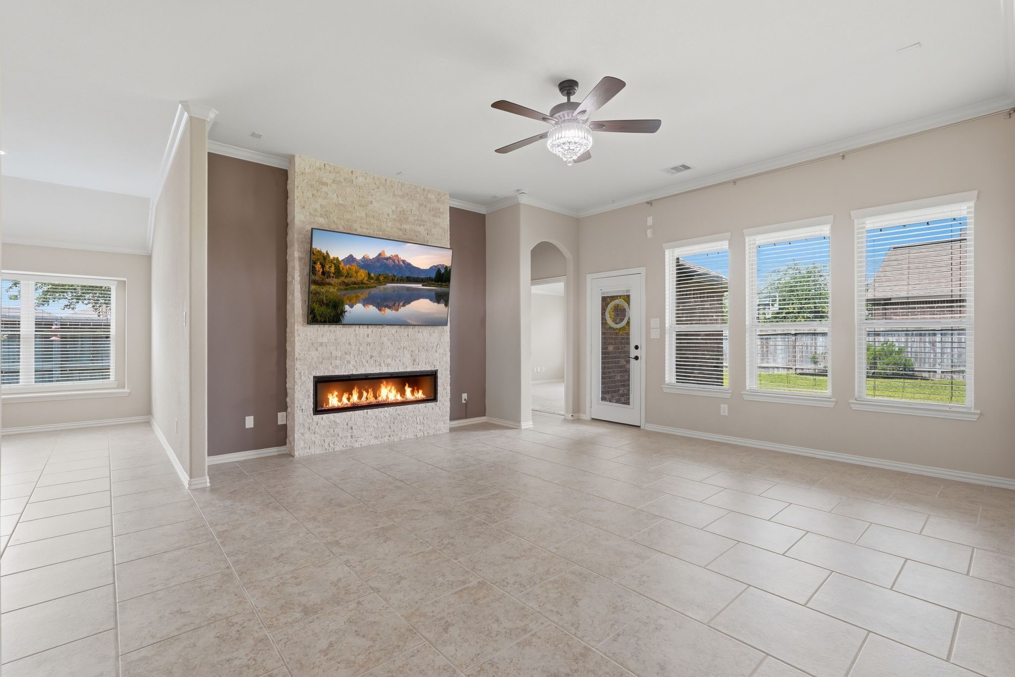 18227 Tacoma Ridge Drive Tomball, TX 77377 - Photo 16 of 45 Striking fireplace creates a warm focal point in this bright and open living space.