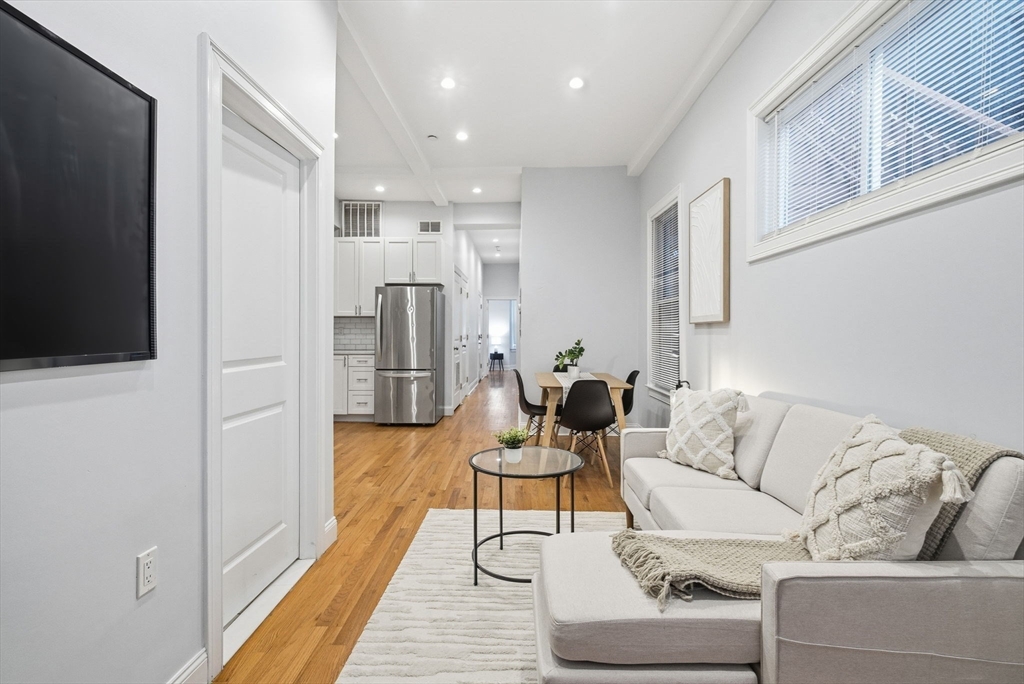 80 Marion Street, Unit 2 Boston, MA 02128 - Photo 11 of 33 a living room with furniture and a flat screen tv