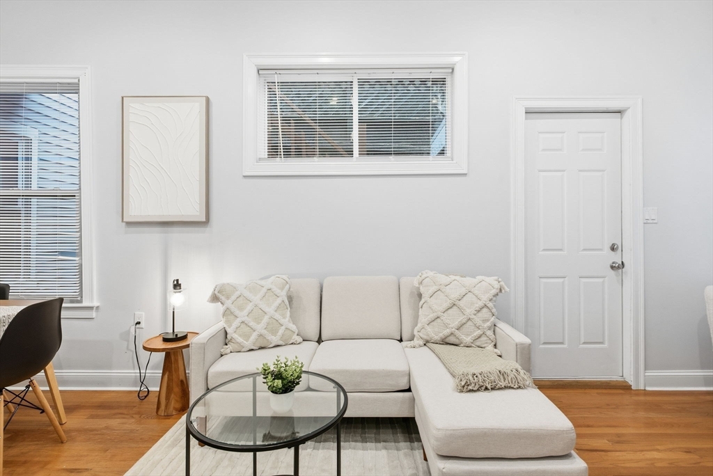 80 Marion Street, Unit 2 Boston, MA 02128 - Photo 13 of 33 a living room with furniture and a window