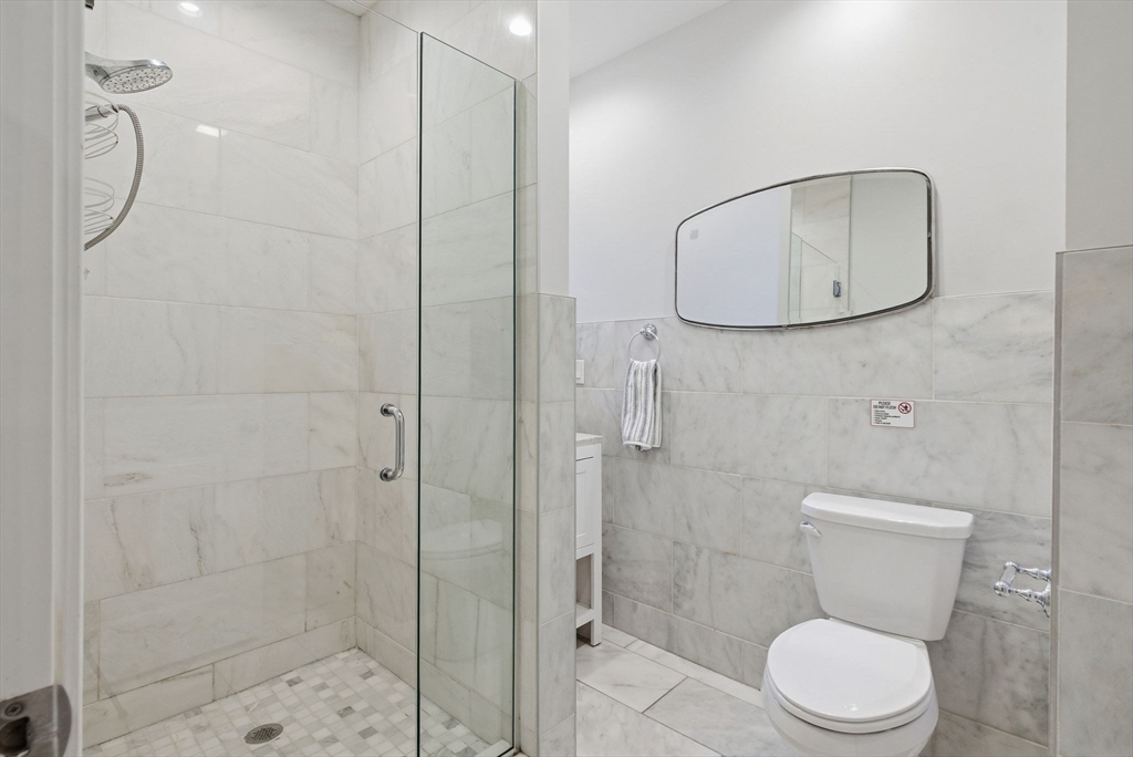 80 Marion Street, Unit 2 Boston, MA 02128 - Photo 15 of 33 a bathroom with a toilet and a shower