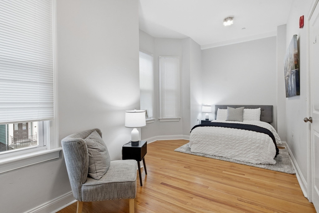80 Marion Street, Unit 2 Boston, MA 02128 - Photo 16 of 33 a bedroom with a bed chair and window