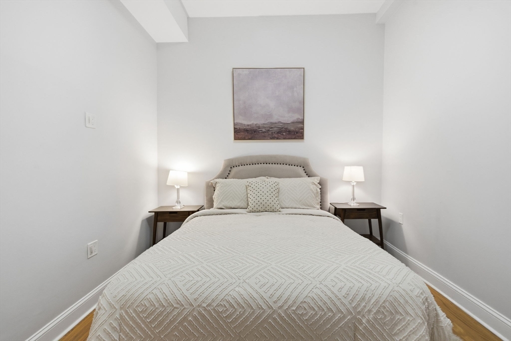 80 Marion Street, Unit 2 Boston, MA 02128 - Photo 24 of 33 a bedroom with a bed and a night lamp