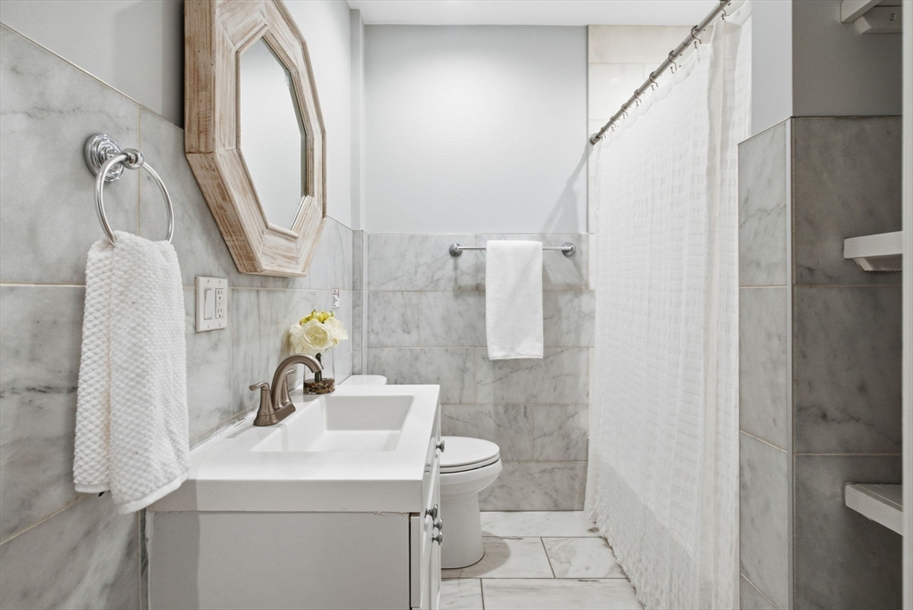 80 Marion Street, Unit 2 Boston, MA 02128 - Photo 26 of 33 a bathroom with a sink toilet and shower
