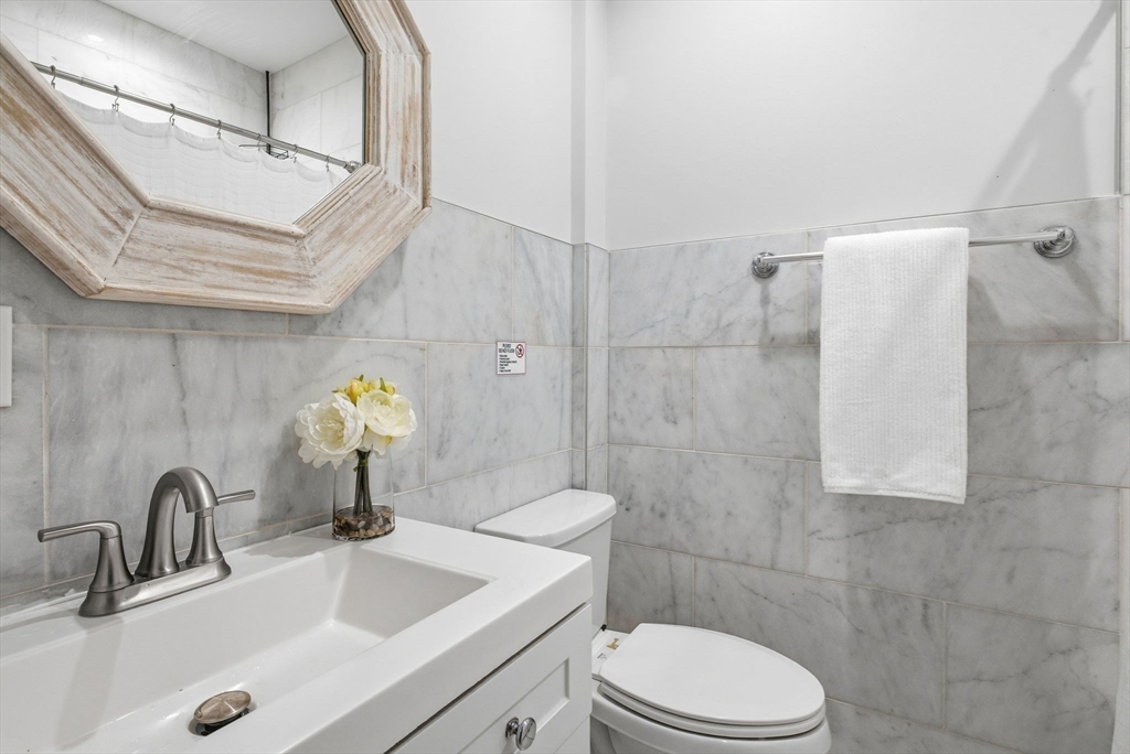 80 Marion Street, Unit 2 Boston, MA 02128 - Photo 27 of 33 a bathroom with a sink toilet and shower