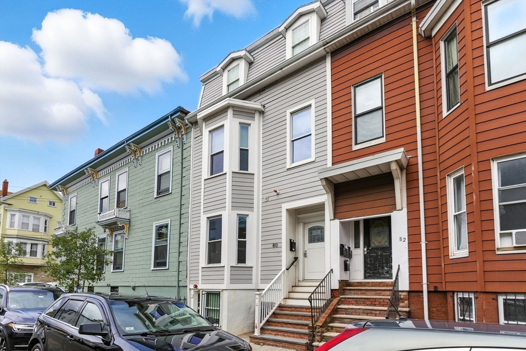 80 Marion Street, Unit 2 Boston, MA 02128 - Photo 32 of 33 a front view of a building with many windows