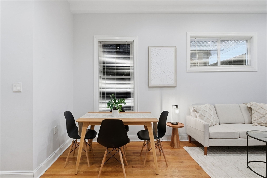 80 Marion Street, Unit 2 Boston, MA 02128 - Photo 7 of 33 a view of a dining room with furniture and wooden floor