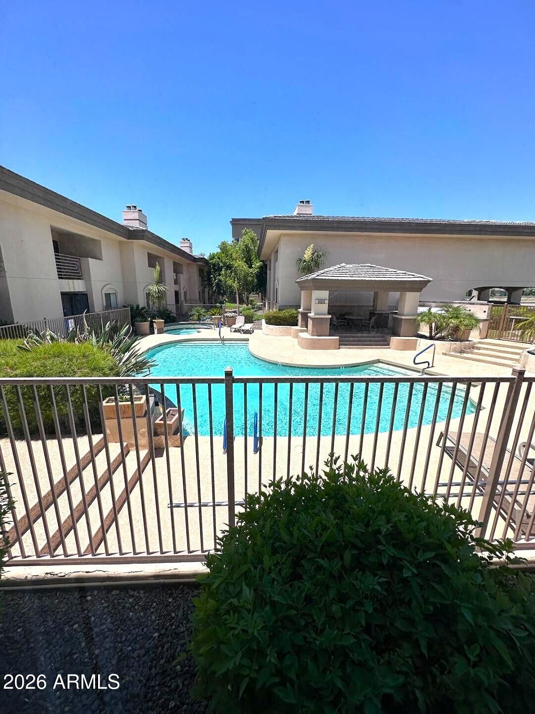 3235 East Camelback Road, Unit 114 Phoenix, AZ 85018 - Photo 9 of 12 POOL VIEW FROM PATIO