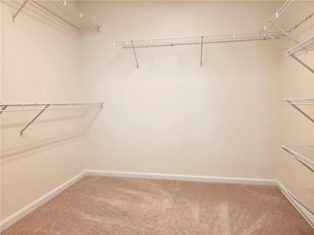 3715 Ridgeside Court Suwanee, GA 30024 - Photo 25 of 44 a view of a room with racks on the wall
