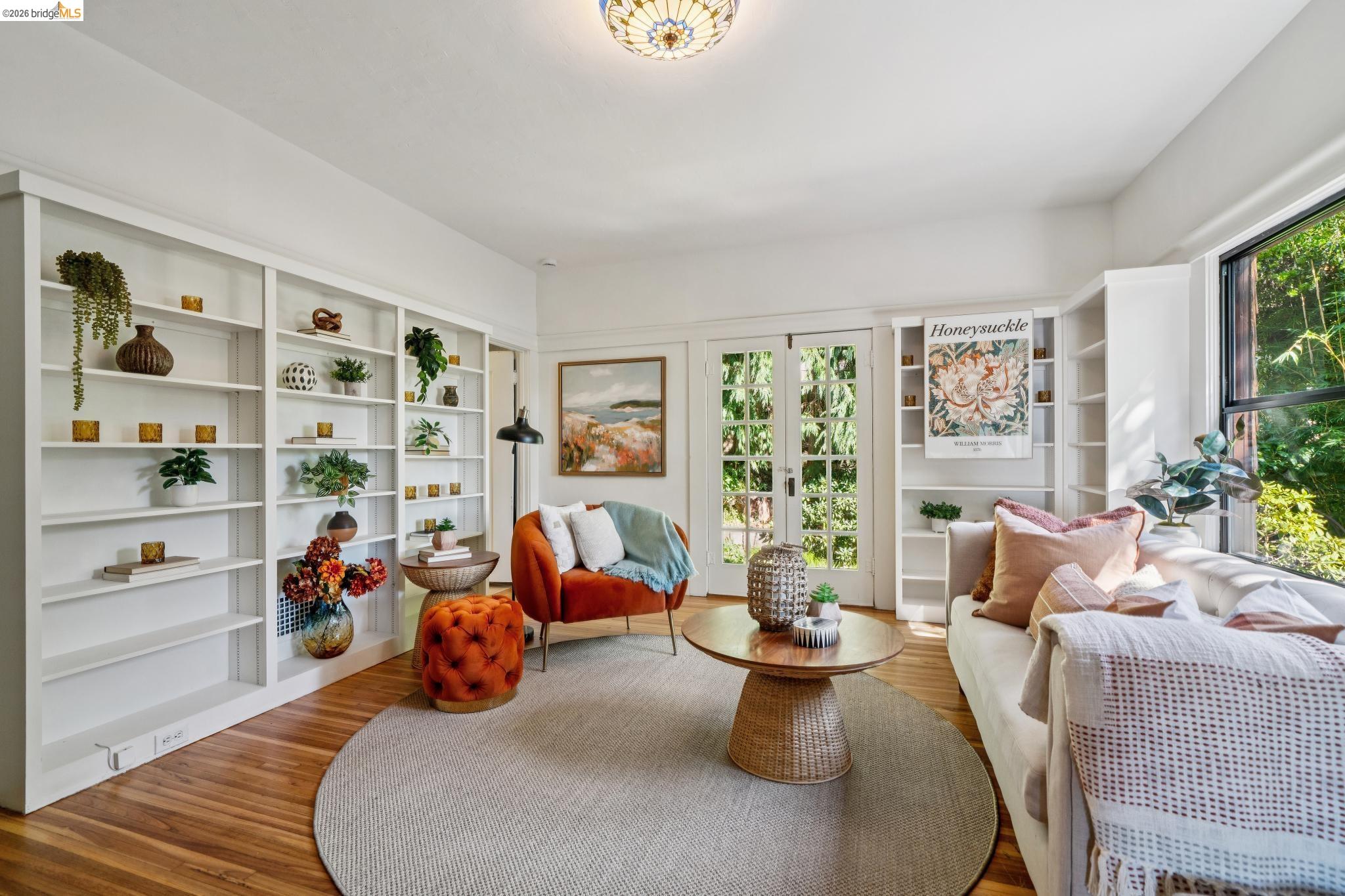 813 San Diego Road Berkeley, CA 94707 - Photo 29 of 60 a living room with furniture a rug and white walls