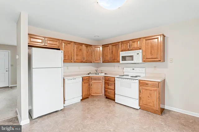 a kitchen with a refrigerator stove and microwave